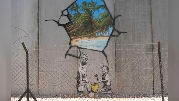 Graffiti von Banksy an der West Bank Mauer in Bethlehem, Israel.